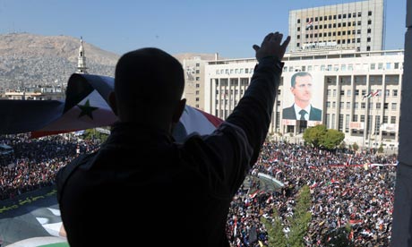 Syrians demonstrating against the Arab League's decision to impose sanctions on the country