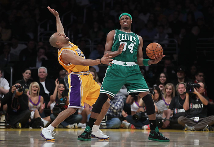 NBA Preview: Boston Celtics' Paul Pierce is defended by Derek Fisher of the LA Lakers
