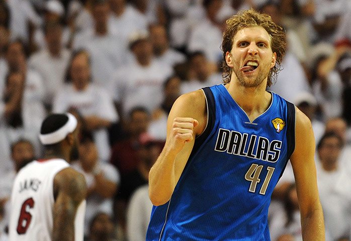 NBA Preview: Dirk Nowitzki of the Dallas Mavericks celebrates against the Miami Heat