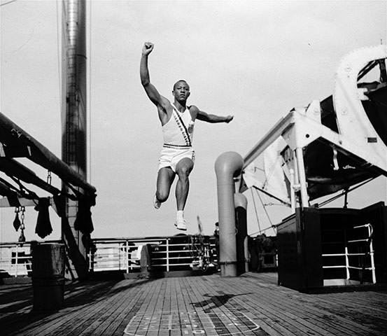 Jesse Owen: Jesse Owens practices long jump onboard the S.S. Manhatten 