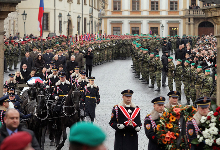 Vaclav Havel funeral: Mourners carrying the coffin as it enters Prague Castle