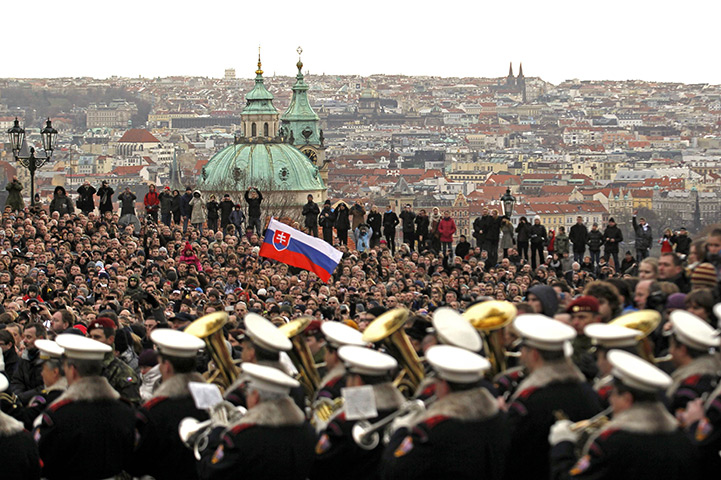 Vaclav Havel funeral: People gather as the coffin is transported on gun carriage to Prague Castle