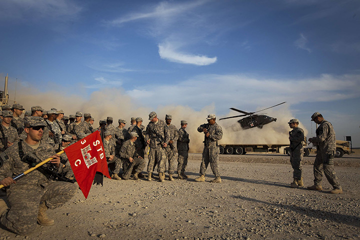 FTA: Lucas Jackson: Soldiers from the 3rd Brigade Combat Team hold their unit's flag 