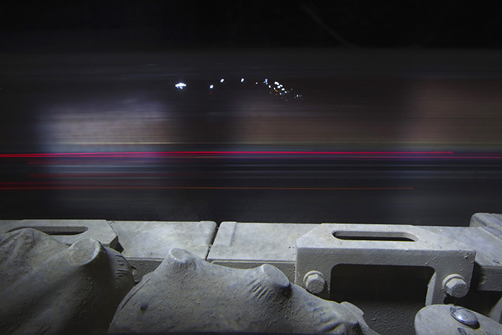 FTA: Lucas Jackson: A car speeds past a Mine Resistant Ambush Protected (MRAP) vehicle