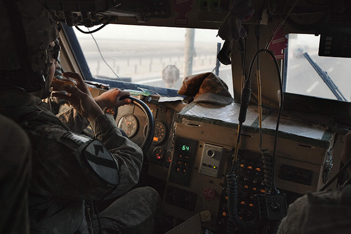 FTA: Lucas Jackson: A soldier eats a sandwich while driving MRAP vehicle near Nasiriyah