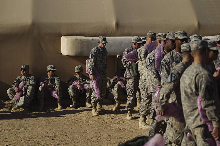 FTA: Lucas Jackson: Soldiers stand in line to pack their weapons for shipment back to the US