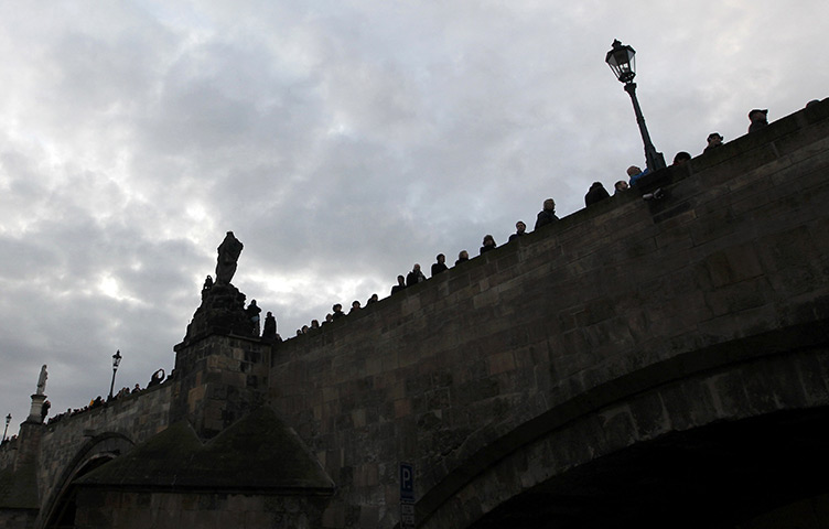 24 hours in pictures: hearse transporting late former Czech President Havel