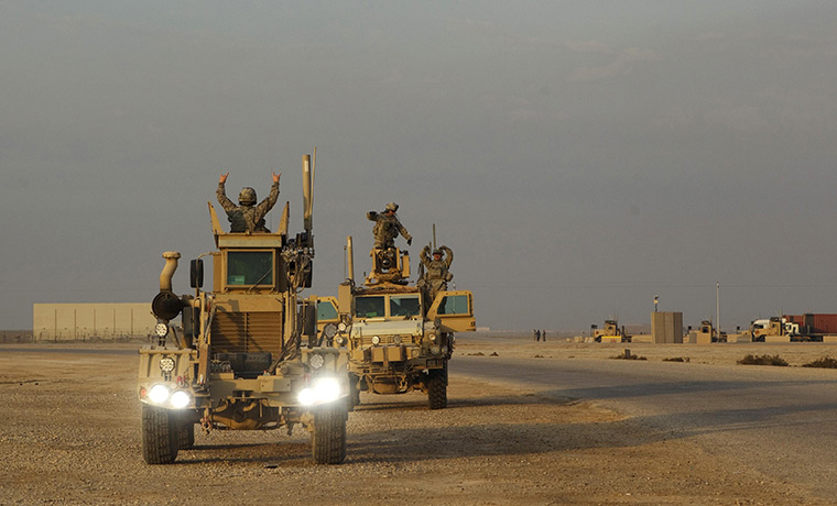 FTA: Lucas Jackson: Soldiers celebrate through the roof hatches of their MRAP vehicles