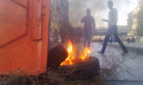 Demonstrators protest against Syria's president, Bashar al-Assad, in Damascus