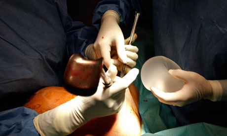 Plastic surgeon Boucq replaces a defective breast implant at a clinic in Nice