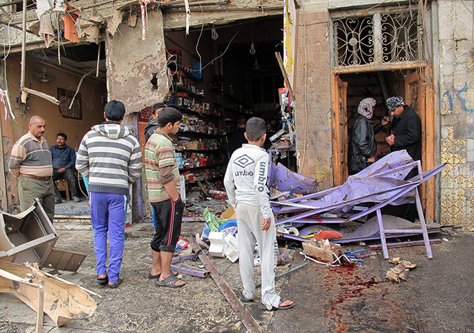 Iraq bombing: Iraqis inspect the damage after a wave of attacks