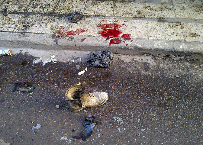 Iraq bombing: A soldier's boot and blood stains on the ground in Alawi , Baghdad