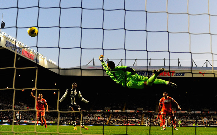 Week in Sport: Swansea goalkeeper Michel Vorm saves a shot by Newcastle United's Demba Ba