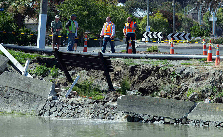 Christchurch earthquake: Government officials survey a collapsed bank and broken water line