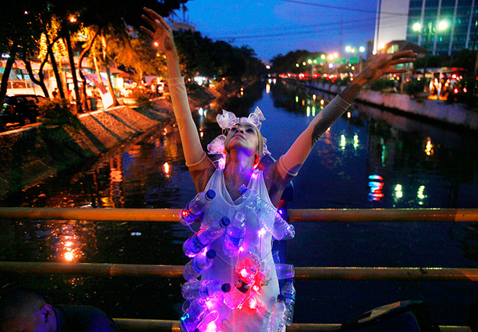 24 hours in pictures: Jakarta, Indonesia: A dancer performs 'Kali Mati' (Dead River)