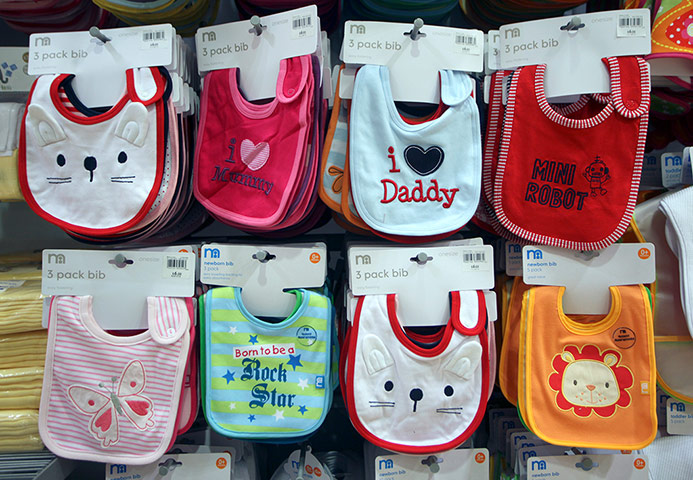Review 2011: companies: Baby's bibs sit on display at a Mothercare store