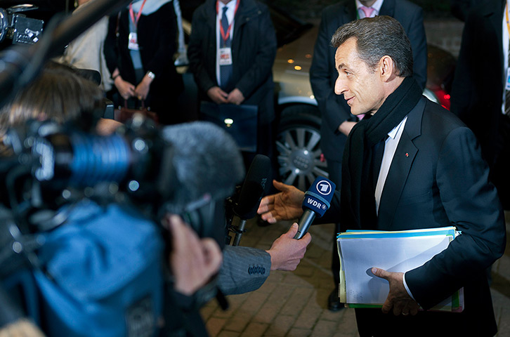 Year in review: Business: Sarkozy arrives for a meeting at the European Council headquarters