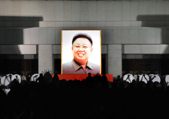 24 hours in pictures: Pyongyang, North Korea: People pay respects to the late North Korean leader Kim Jong-Il.