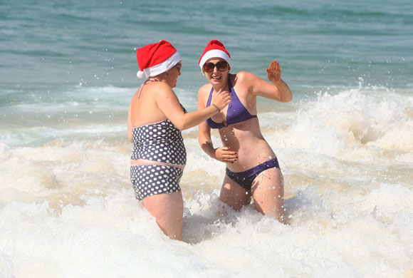 24 hours in pictures: Sydney, Australia: Women play in the shallow water at Bondi Beach