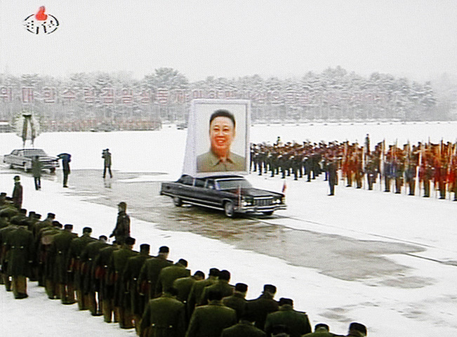 Kim Jong-il funeral: A portrait of Kim Jong Il is carried during his funeral procession