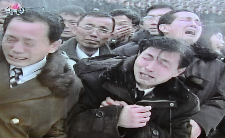 Kim Jong-il funeral: Men in mourning during the procession