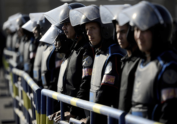 24 hours in pictures: Cairo, Egypt: Anti-riot police stand guard
