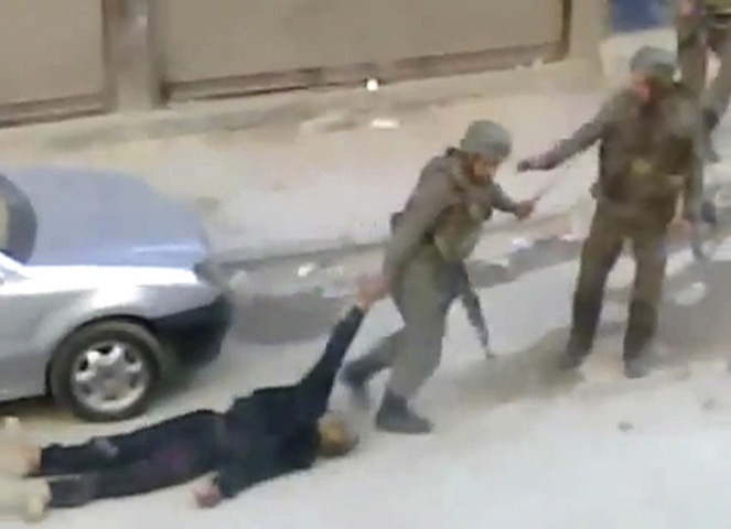 Camera phones: 10 November 2011: Troops dragging a body away in Damascus