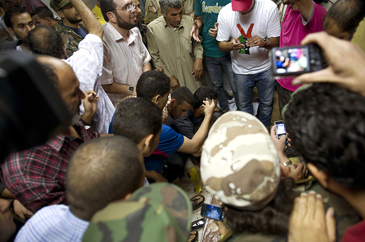 Camera phones: 20 October 2011: Libyans gather around the body of Colonel Muammar Gaddafi