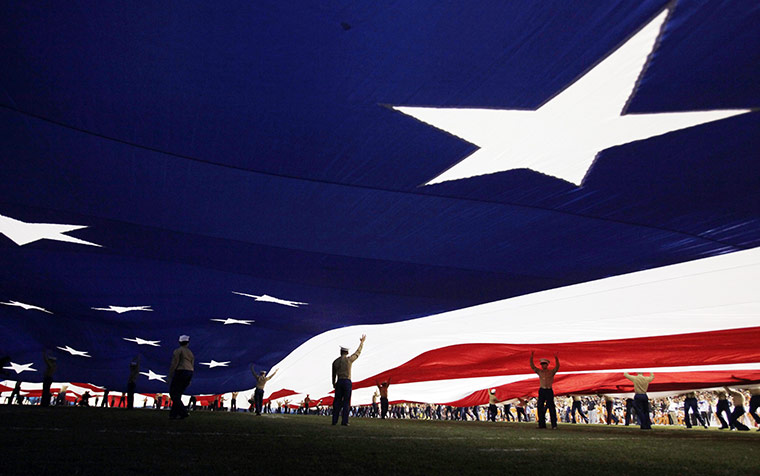 pictures of the week: US Marines hold up a giant stars and stripes flag