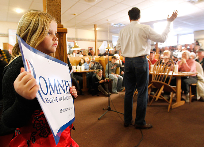 Iowa campaigning: Supporters listen to former Massachusetts Gov. Mitt Romney