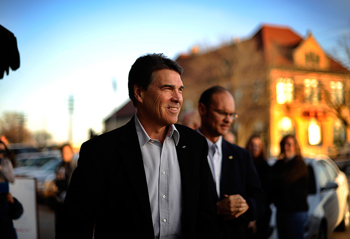 Iowa campaigning: Rick Perry leaves an event at the Adams Street Espresso in Creston, Iowa