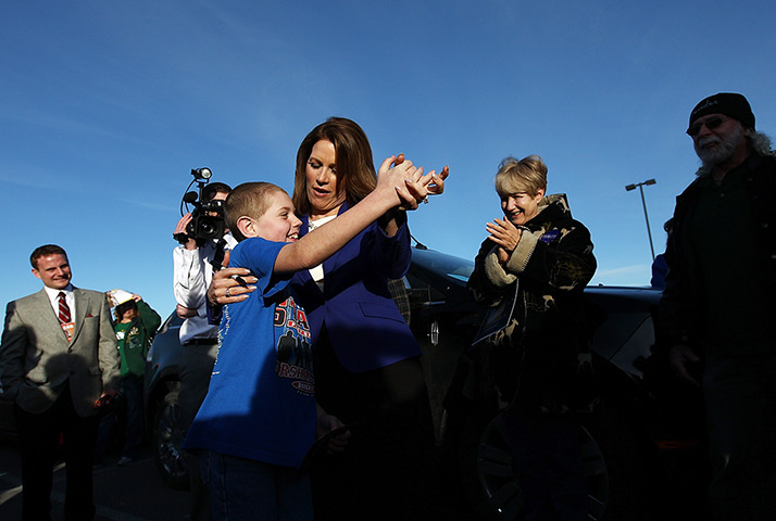 Iowa campaigning: Michele Bachmann (R-MN) dances with 9-year old Shayne Holmes