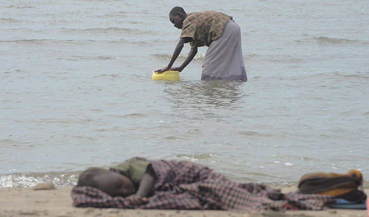 2011 in Environment:  A Turkana woman fetches water in Lake Turkana