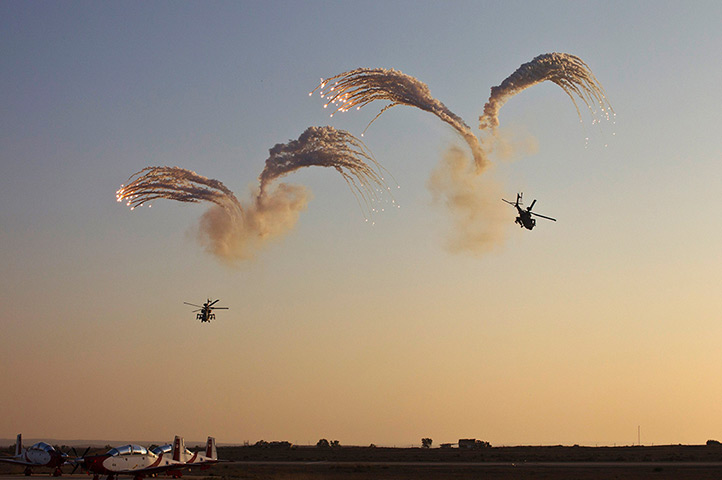 24 hours : Israel: Israeli Apache helicopters release flares at a graduation ceremony