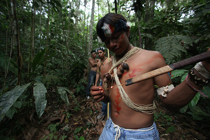 Yasuni National Park: A Waorani indigenous youth prepares to use his blowpipe