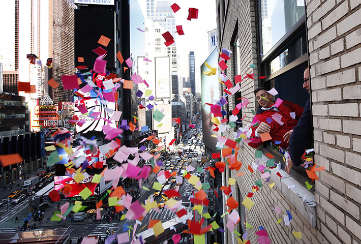 New year preparations: New York City, USA: Organisers toss confetti from a window in Times Square