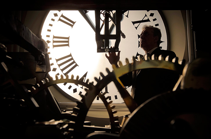 New year preparations: Madrid, Spain: A clockmaker checks the Puerta del Sol Square clock