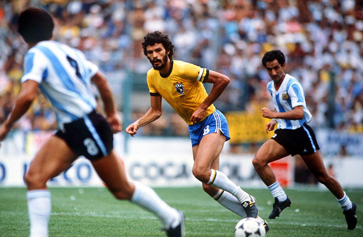 Socrates  : Socrates is chased by Osvaldo Ardiles of Argentina in the 1982 world cup