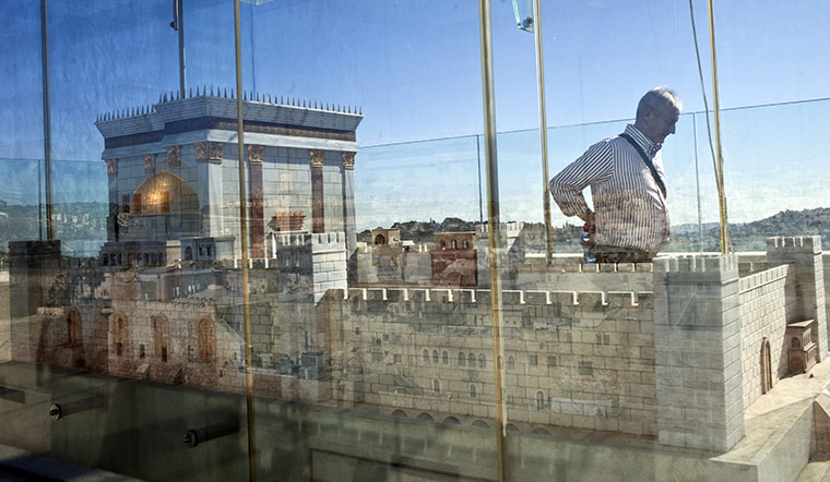 24 hours in pictures: Jerusalem: A German tourist passes by a model of the ancient Second Temple