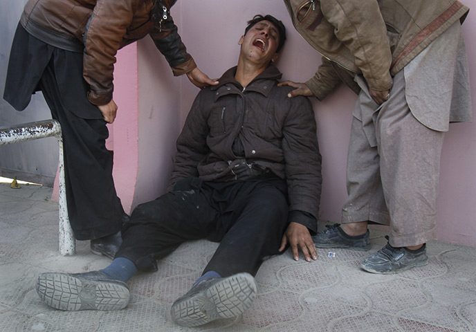Kabul bombing: grieving man