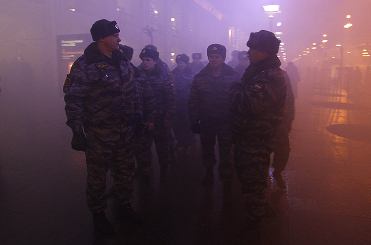 Russia protests: Russian Interior Ministry troops look on during a rally