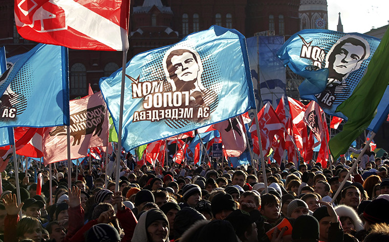Russia protests: Activists from the pro-Kremlin youth movement Nashi (Ours) hold flags 