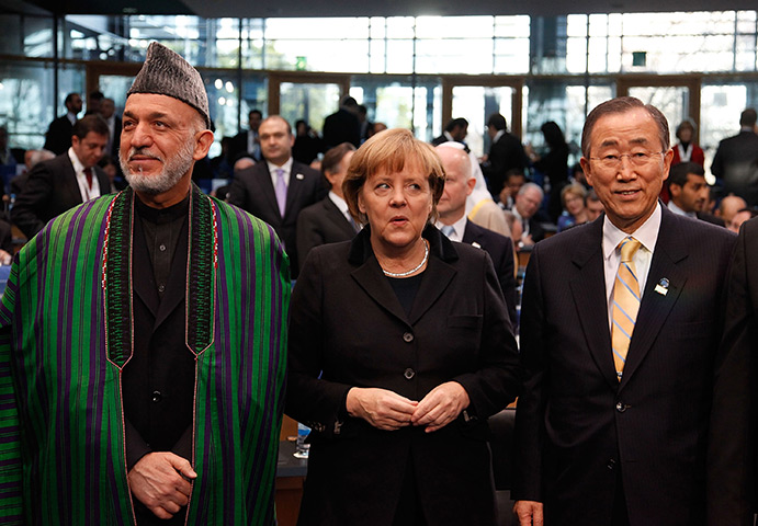24 hours in pictures: Bonn, Germany: Hamid Karzai, Angela Merkel and Ban Ki Moon
