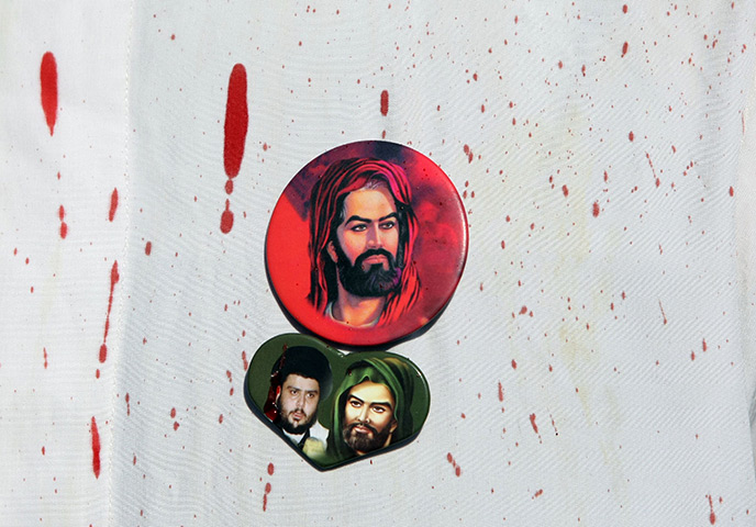 24 hours in pictures: mages of Imam Hussein and radical Iraqi Shiite cleric Moqtada al-Sadr