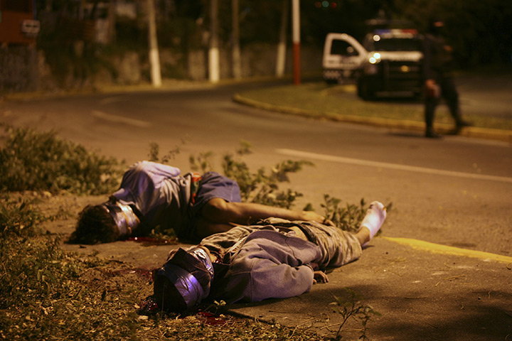 24 hours in pictures: Victims of narco-killings lie by the roadside in Veracruz, Mexico