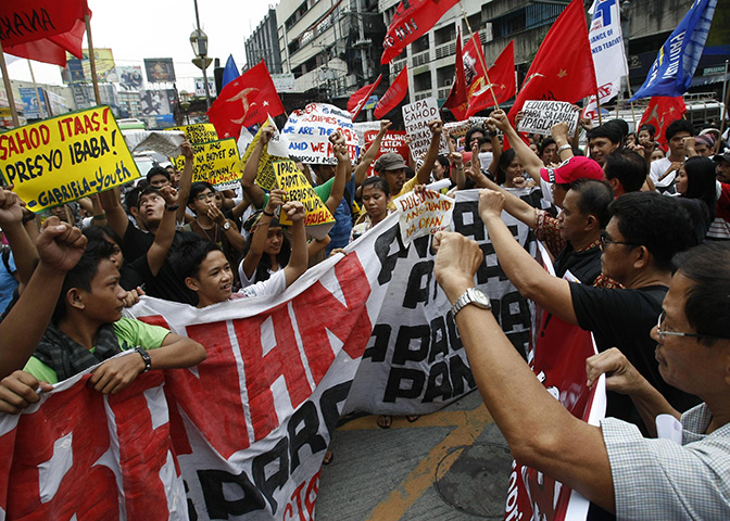 Occupy Mendiola: Protesters shout slogans as they converge at an intersection, Manila