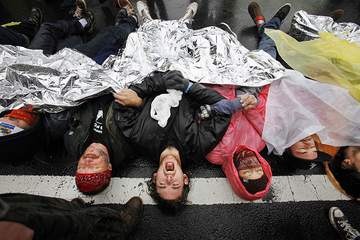 24 hours in pictures: Occupy DC protesters lay across K Street, Washington