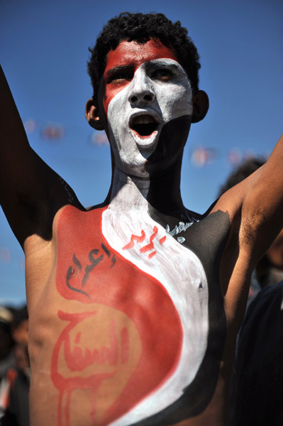 24 hours in pictures: Protester with Yemeni flag painted on his body shouts slogans 