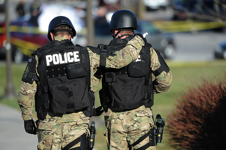 Virginia Tech shooting: Virginia Tech police officers console one another at scene of shooting