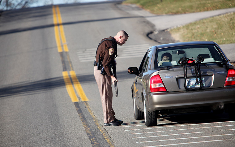 Virginia Tech shooting: A Montgomery County law enforcement officer stops a car, Virginia